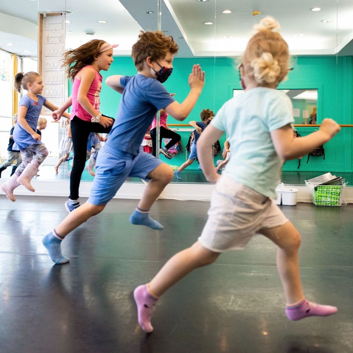 Kids dancing and learning choreography at Toronto camp